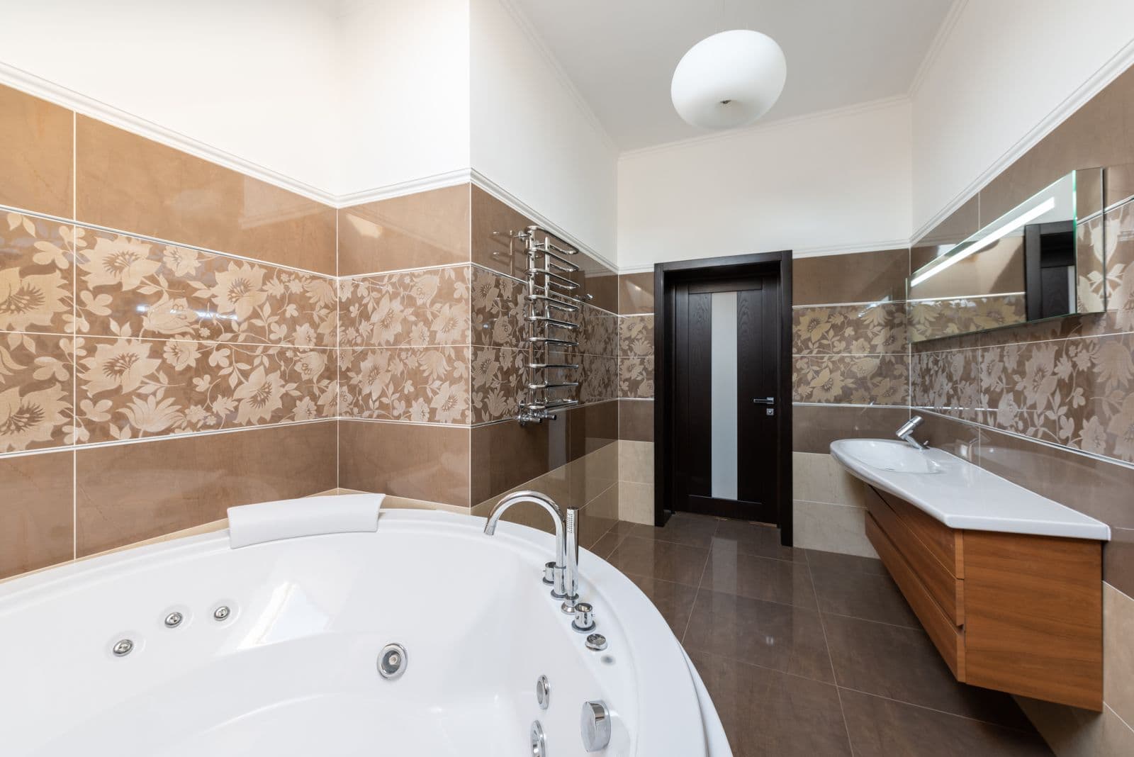 Elegant remodeled master bathroom with soaking tub