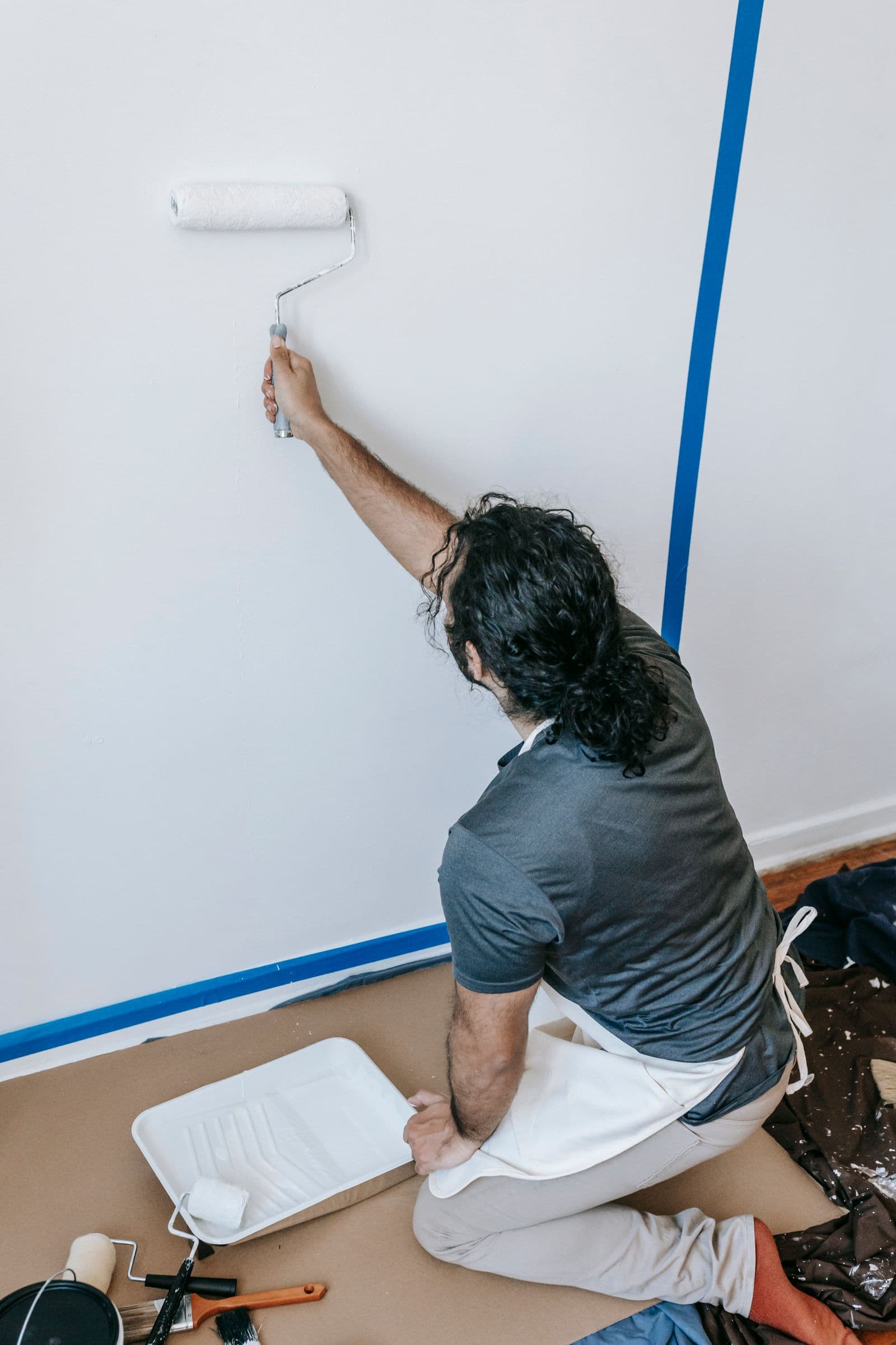 Finishing an interior wall with a paint roller